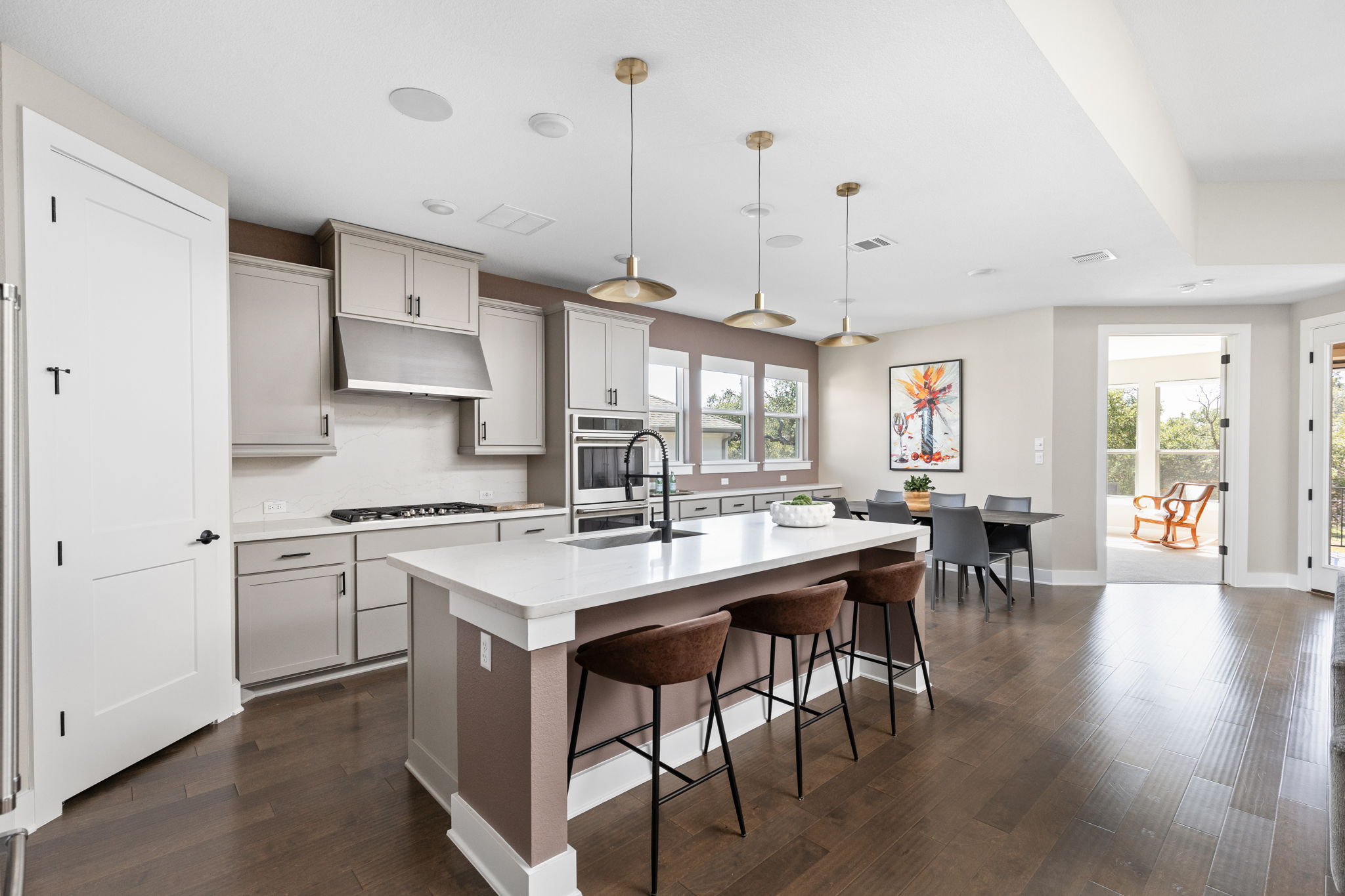 829 Pink Granite Boulevard Dripping Springs, TX 78620 - Photo 6 of 30 Expansive center island offers abundant prep space and seating.