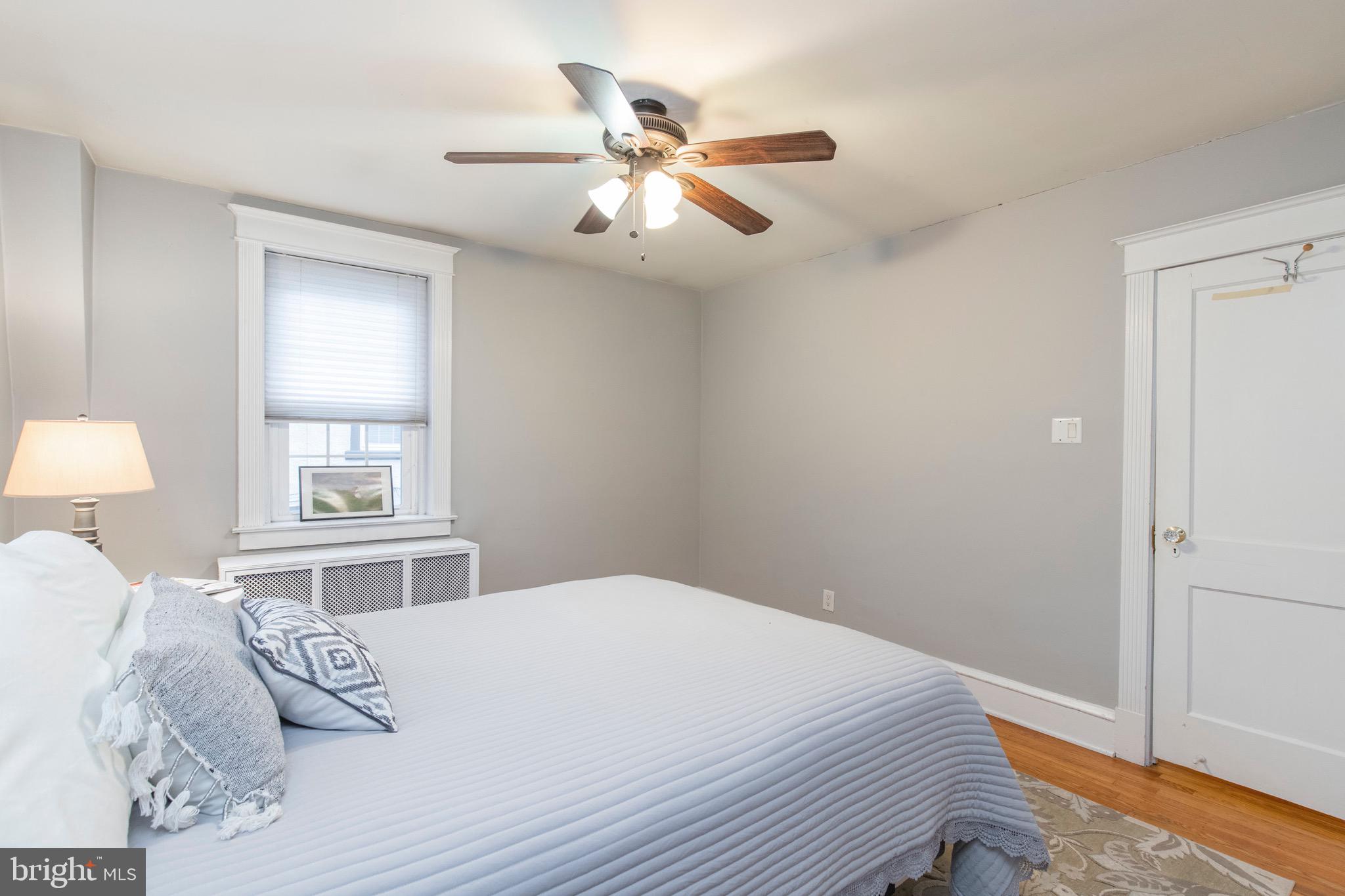 29 Wellington Road Ardmore, PA 19003 - Photo 22 of 25 a bedroom with a large bed and a window