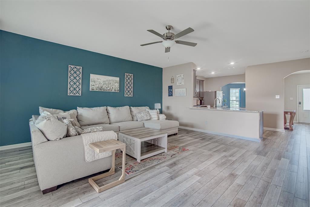 1813 Rialto Lane Crowley, TX 76036 - Photo 12 of 27 a living room with furniture and a wooden floor