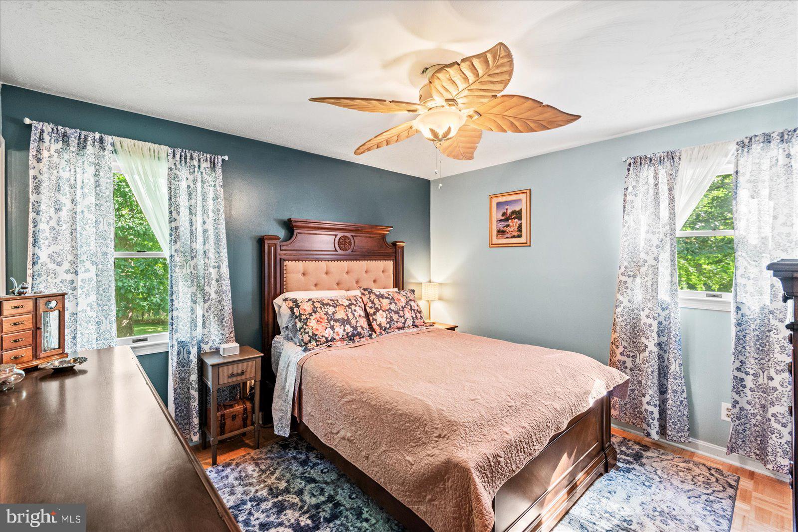 804 Buggy Lane Rochelle, VA 22738 - Photo 19 of 50 a bedroom with a bed and a chandelier