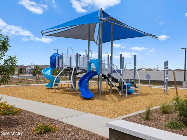 a view of a swimming pool with sitting area