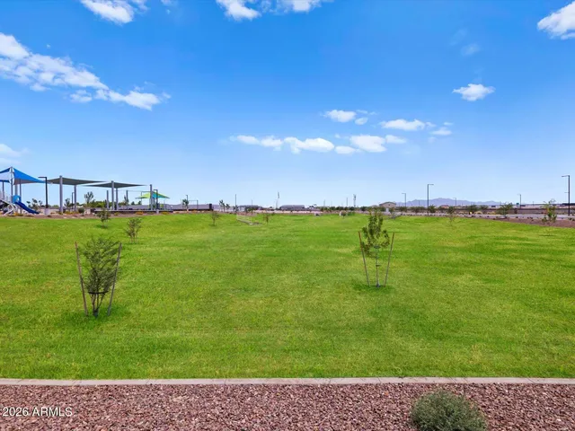 a group of people sitting in front of a swimming pool