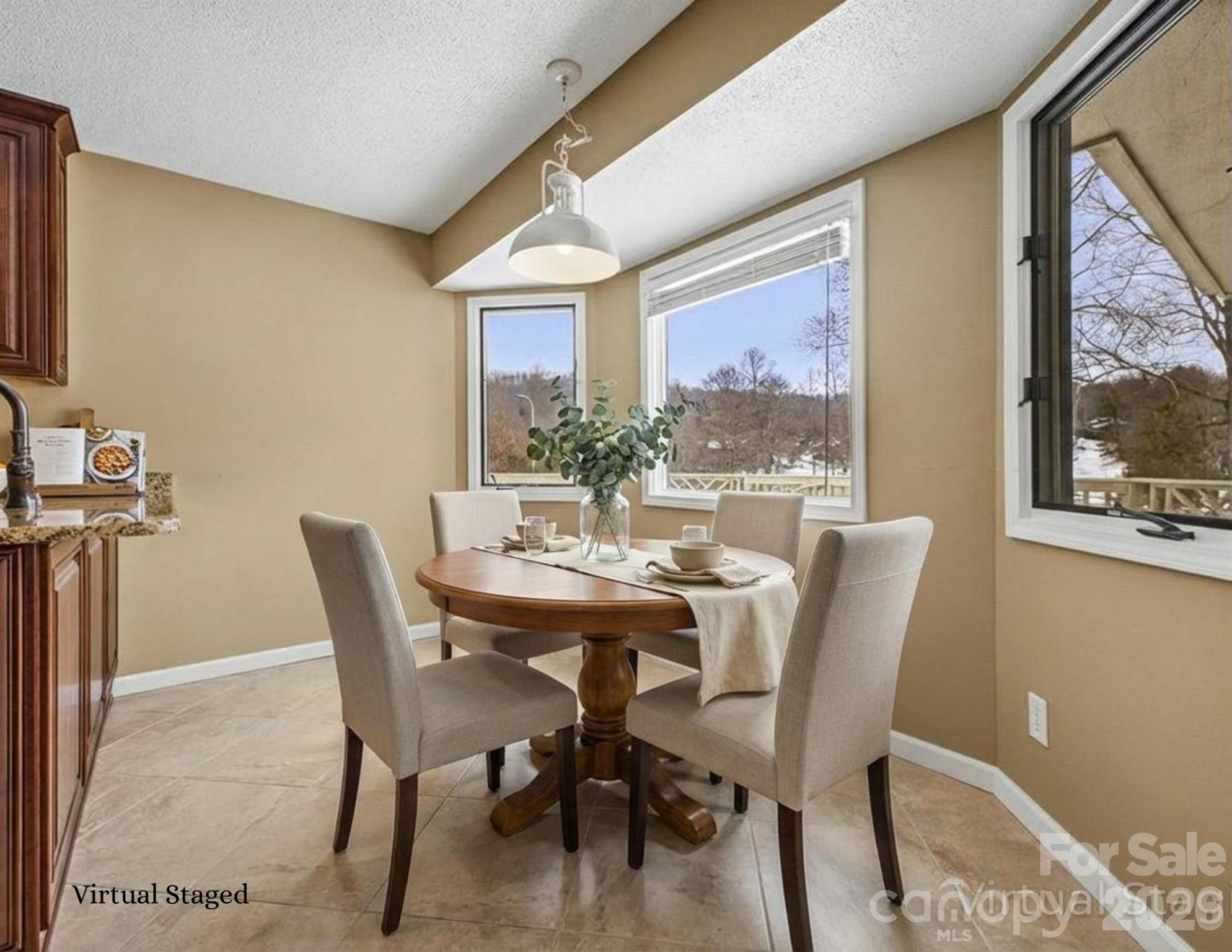 3100 Cove Loop Road Hendersonville, NC 28739 - Photo 17 of 43 a view of a dining room with furniture and window