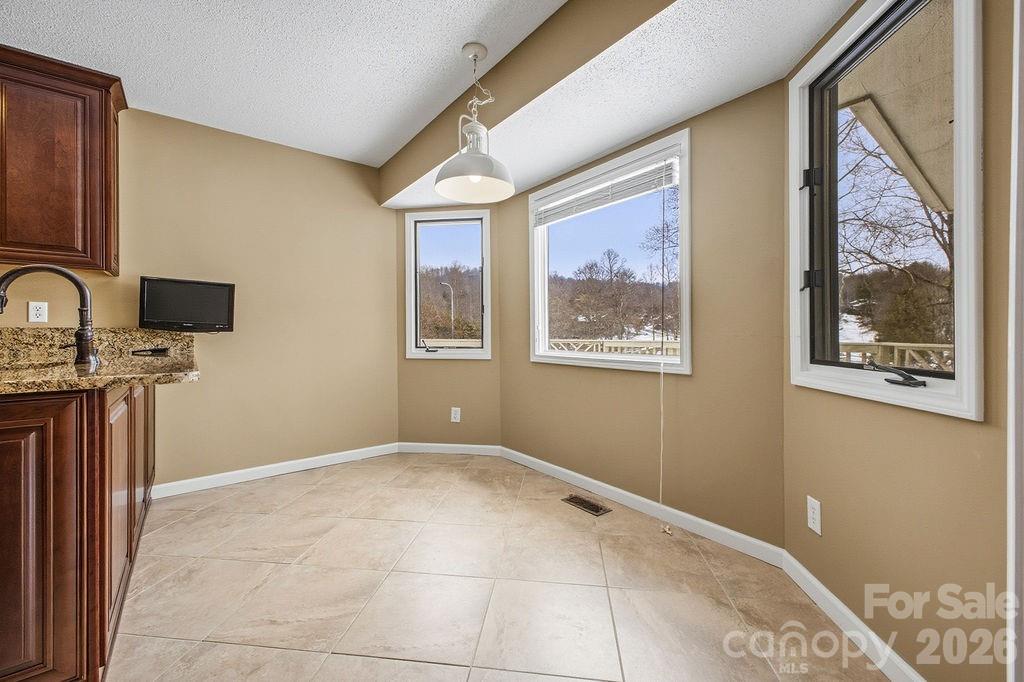 3100 Cove Loop Road Hendersonville, NC 28739 - Photo 18 of 43 a view of a bedroom with wooden floor and a window