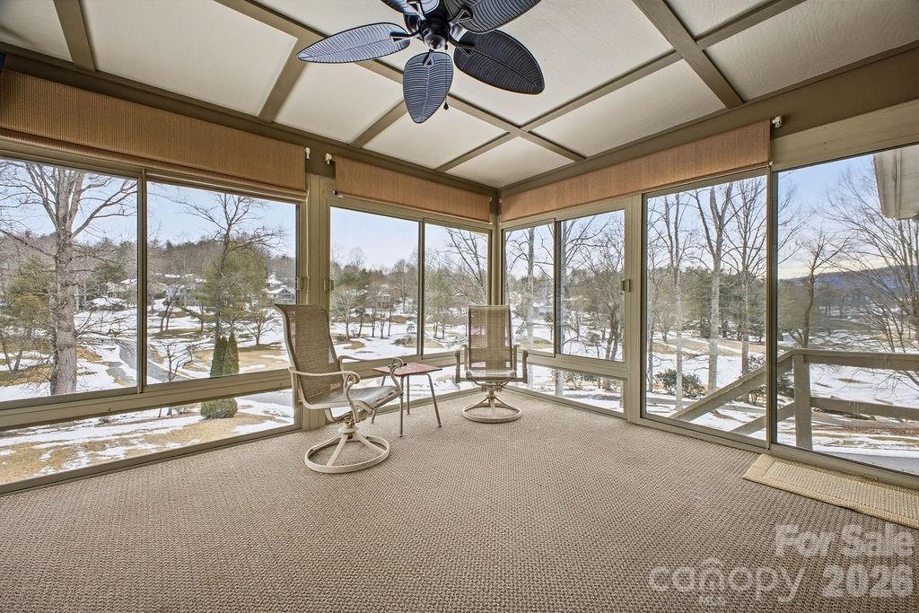 3100 Cove Loop Road Hendersonville, NC 28739 - Photo 20 of 43 a room with lots of windows