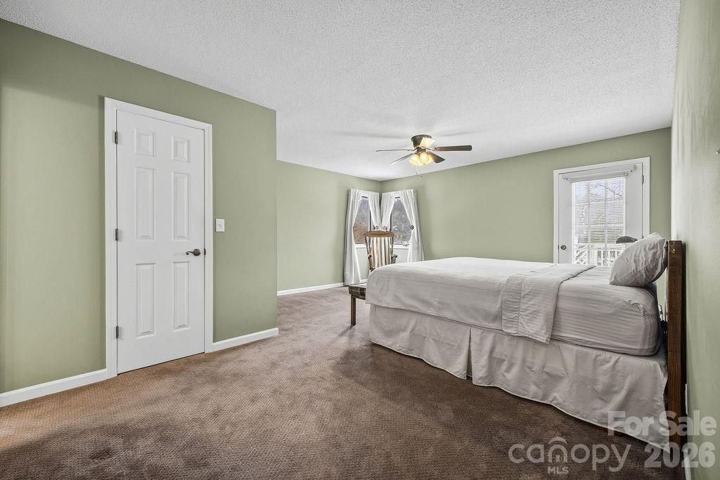 3100 Cove Loop Road Hendersonville, NC 28739 - Photo 22 of 43 a bedroom with a bed and window
