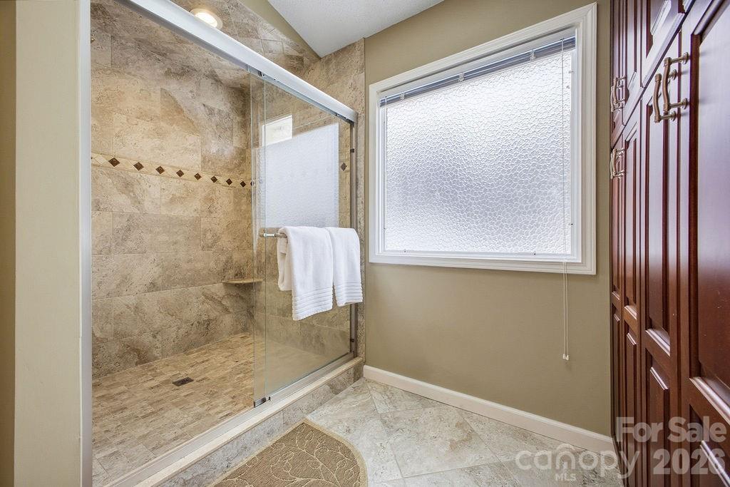 3100 Cove Loop Road Hendersonville, NC 28739 - Photo 24 of 43 a bathroom with a shower