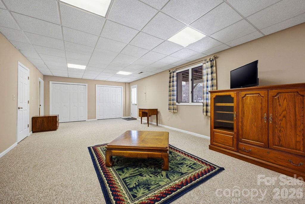 3100 Cove Loop Road Hendersonville, NC 28739 - Photo 33 of 43 a living room with furniture and a flat screen tv