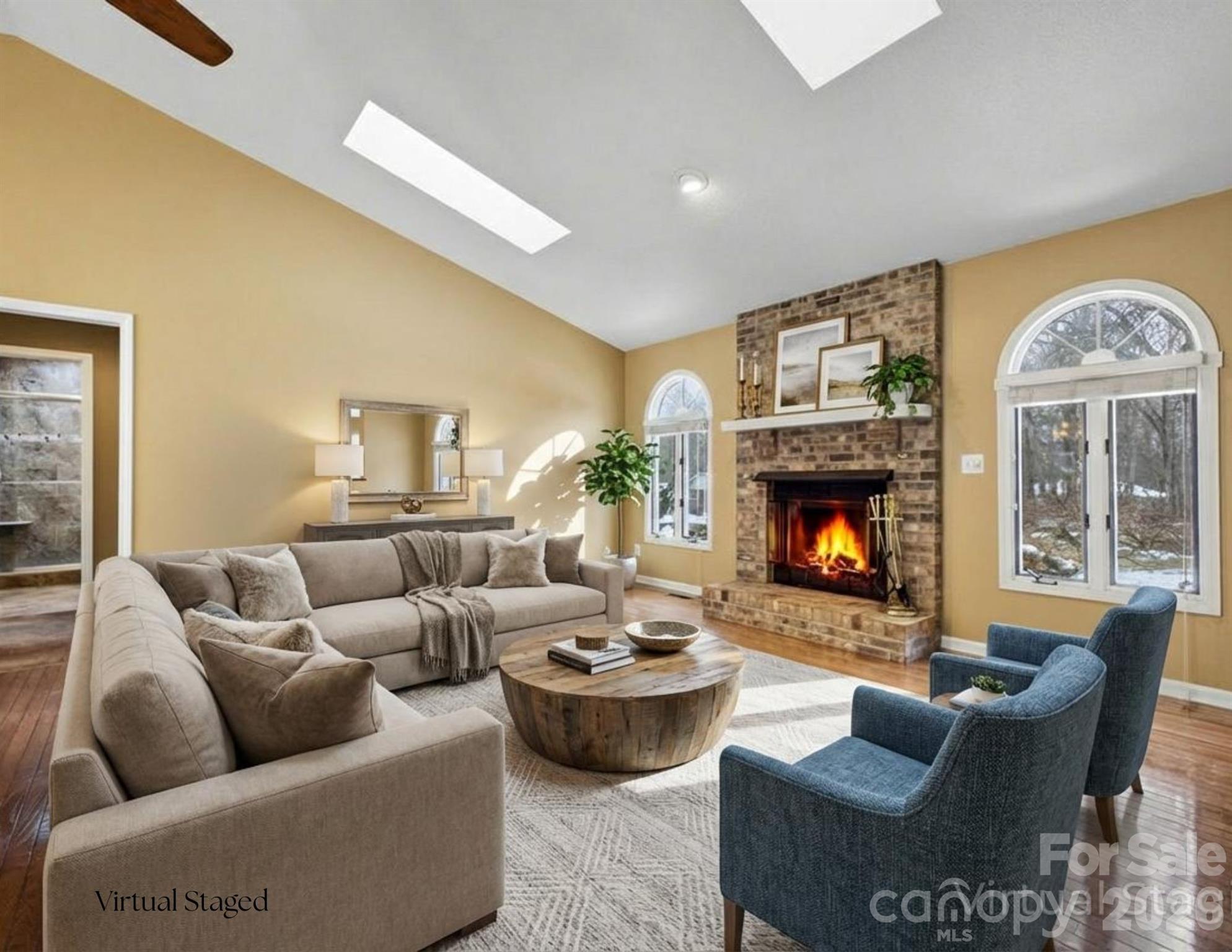 3100 Cove Loop Road Hendersonville, NC 28739 - Photo 7 of 43 a living room with furniture a fireplace and a large window