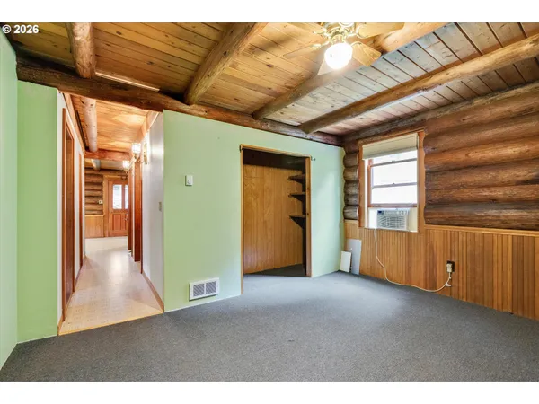a kitchen with stainless steel appliances granite countertop a sink cabinets and wooden floor