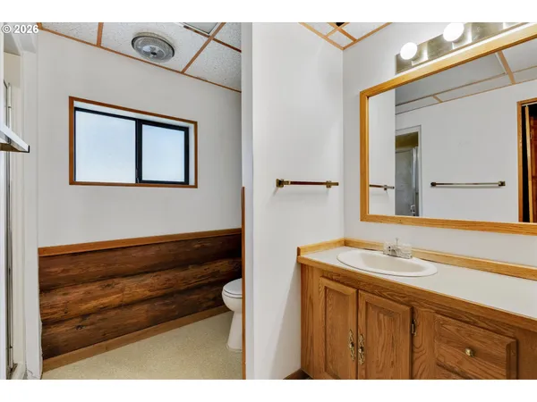 a view of room with window and cabinet