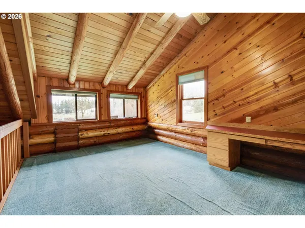 a view of room with window and hardwood floor