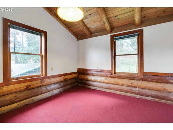 a front view of house with a garden