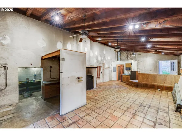 a view of empty room with wooden walls