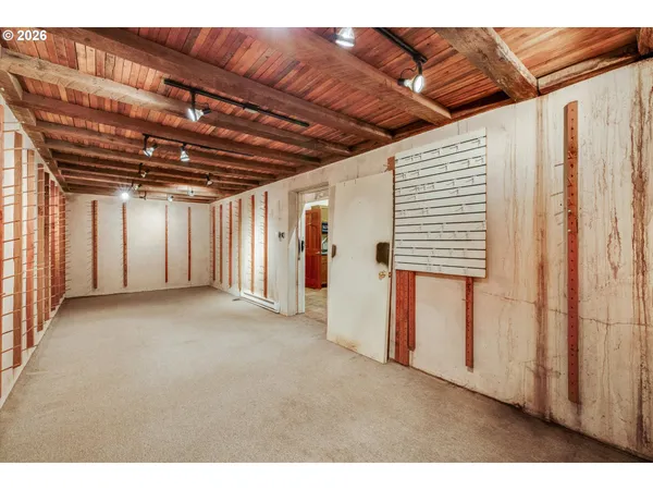 a view of a yard with wooden fence