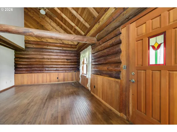 a view of an entryway with wooden floor