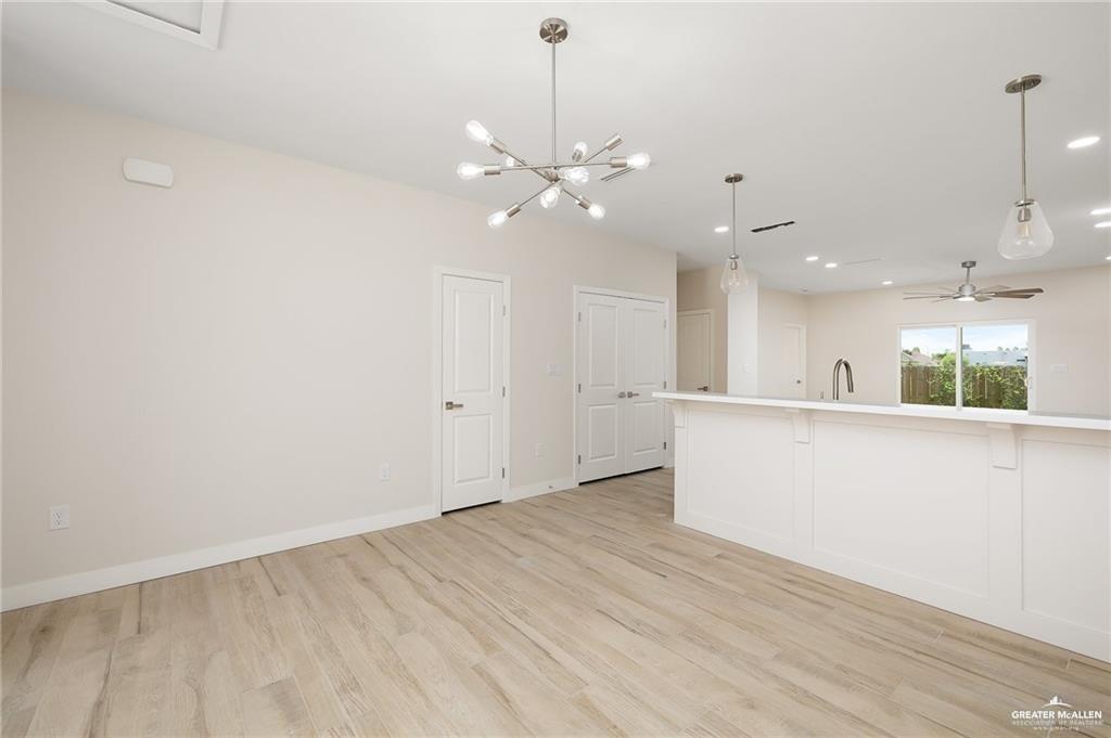 2508 East Solar Drive Mission, TX 78574 - Photo 3 of 13 a view of an empty room with window and wooden floor