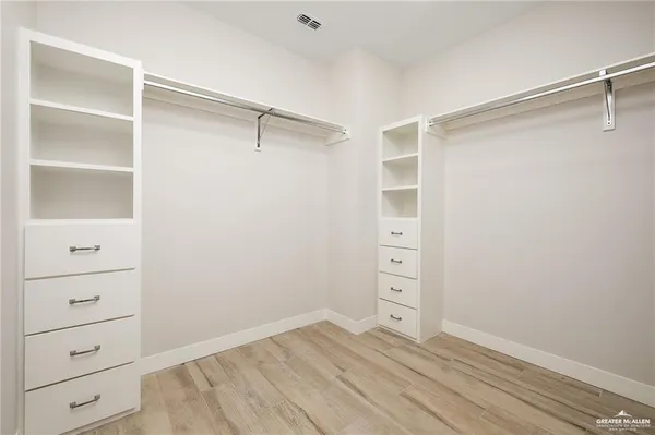 a view of an empty walk in closet