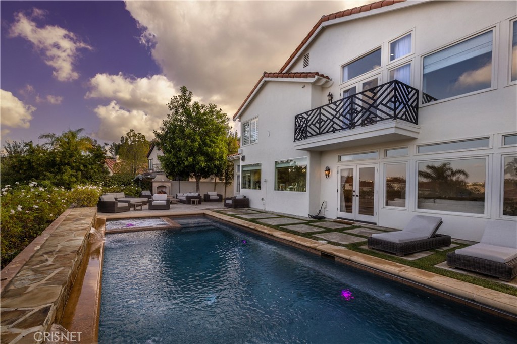 3626 Paseo Primario Calabasas, CA 91302 - Photo 34 of 41 a view of a patio with swimming pool table and chairs