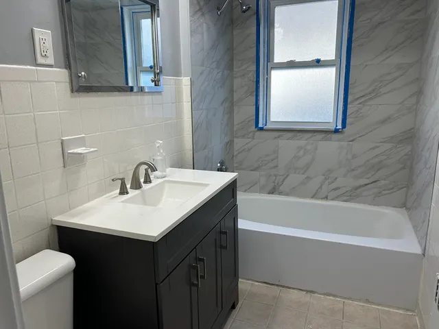 a bathroom with a sink and a bathtub