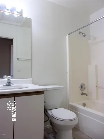 a view of an empty room and a window