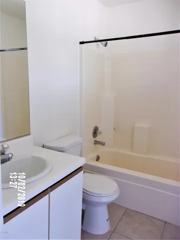 a view of an empty room and a window