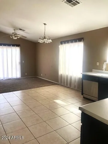 a view of a kitchen with a sink and a window