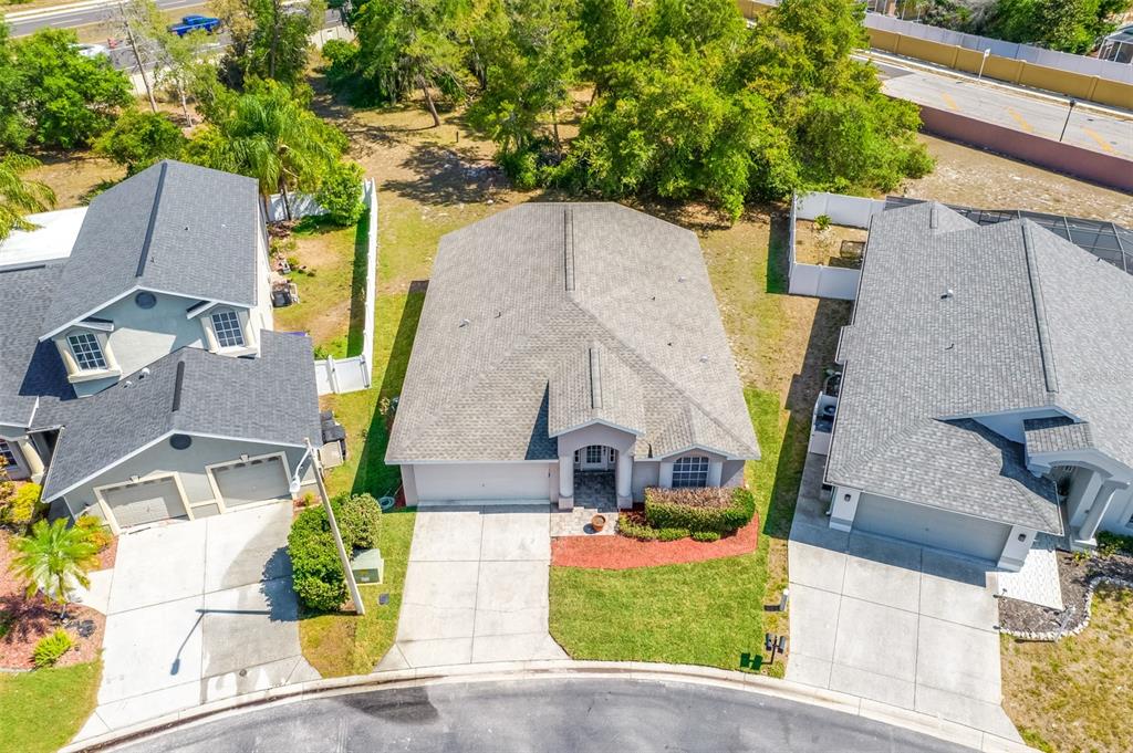 7918 Fashion Loop New Port Richey, FL 34654 - Photo 1 of 1 an aerial view of a house with a garden and plants