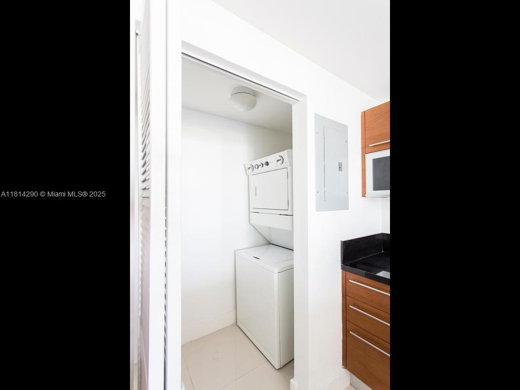 244 Biscayne Boulevard, Unit 2002 Miami, FL 33132 - Photo 9 of 21 a picture of a bathroom with mirror and shower