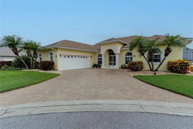 an aerial view of a house with outdoor space and lake view