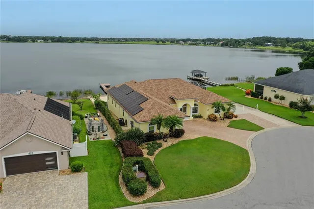 an aerial view of a house with outdoor space