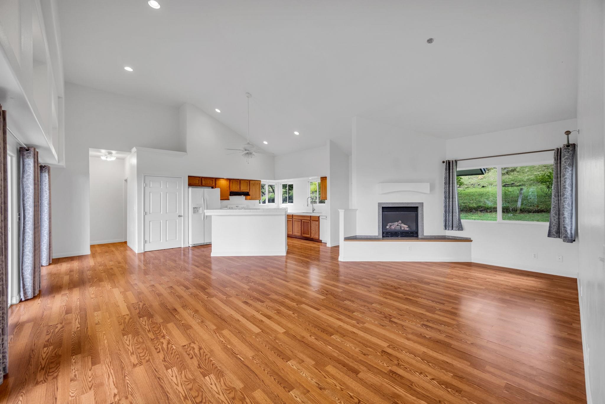 115 Alae Road Kula, HI 96790 - Photo 17 of 50 a view of a big room with wooden floor and a fireplace
