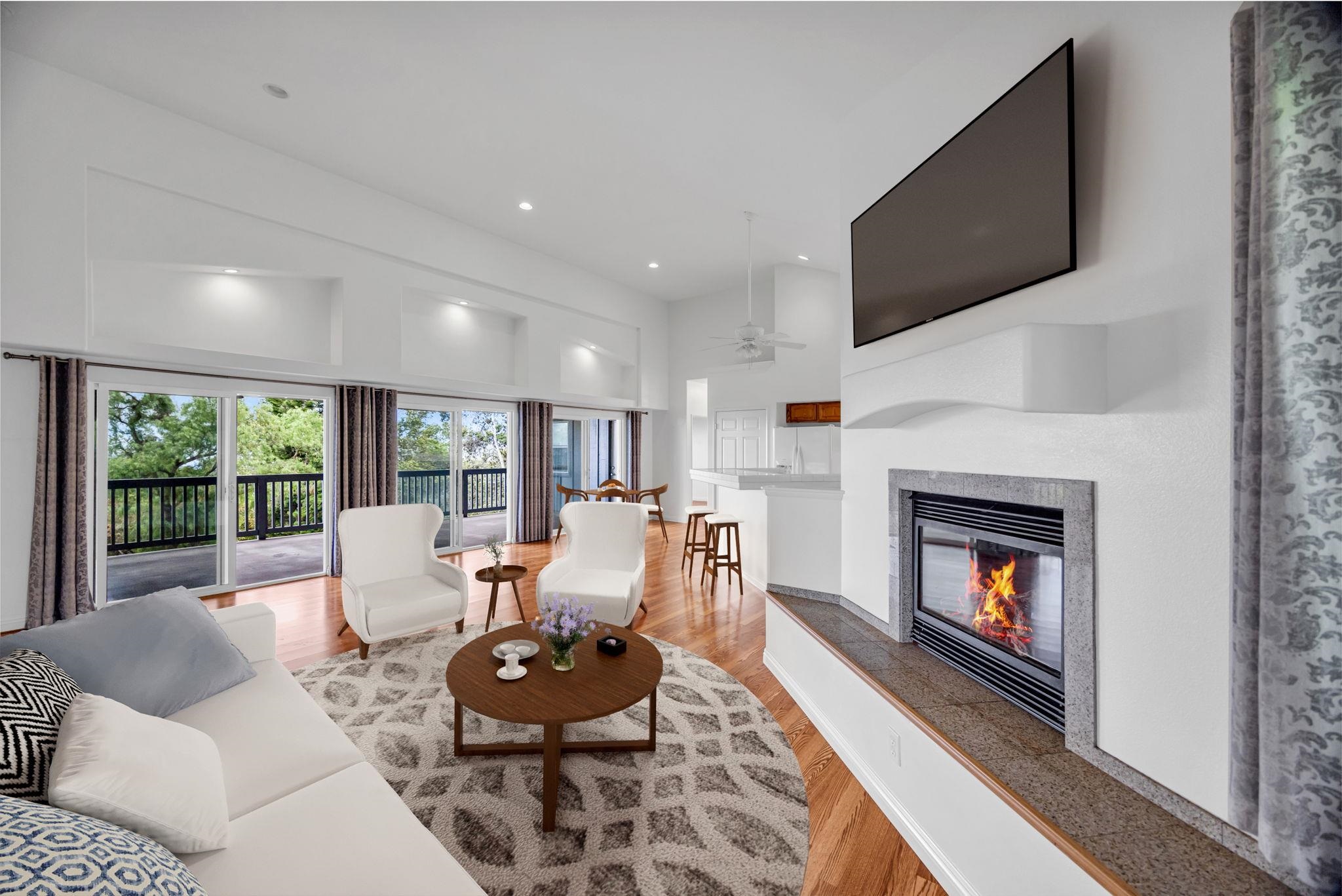 115 Alae Road Kula, HI 96790 - Photo 22 of 50 a living room with furniture a fireplace and a flat screen tv
