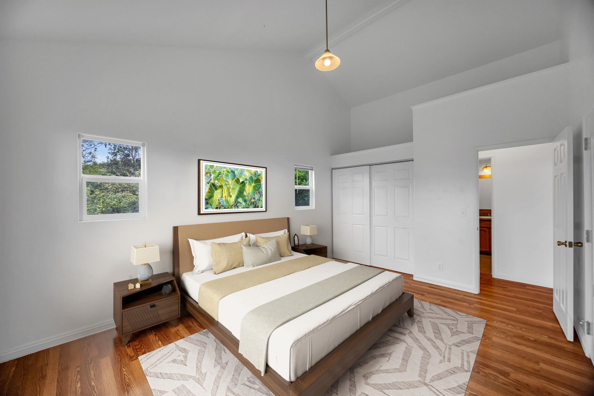 115 Alae Road Kula, HI 96790 - Photo 26 of 50 a bedroom with a bed and wooden floor