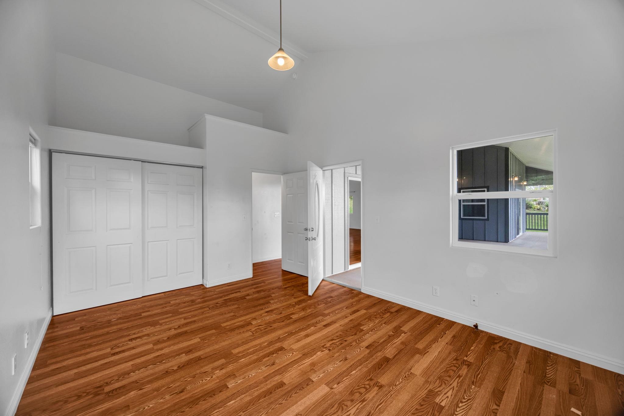 115 Alae Road Kula, HI 96790 - Photo 27 of 50 a bedroom with a bed and a painting on the wall