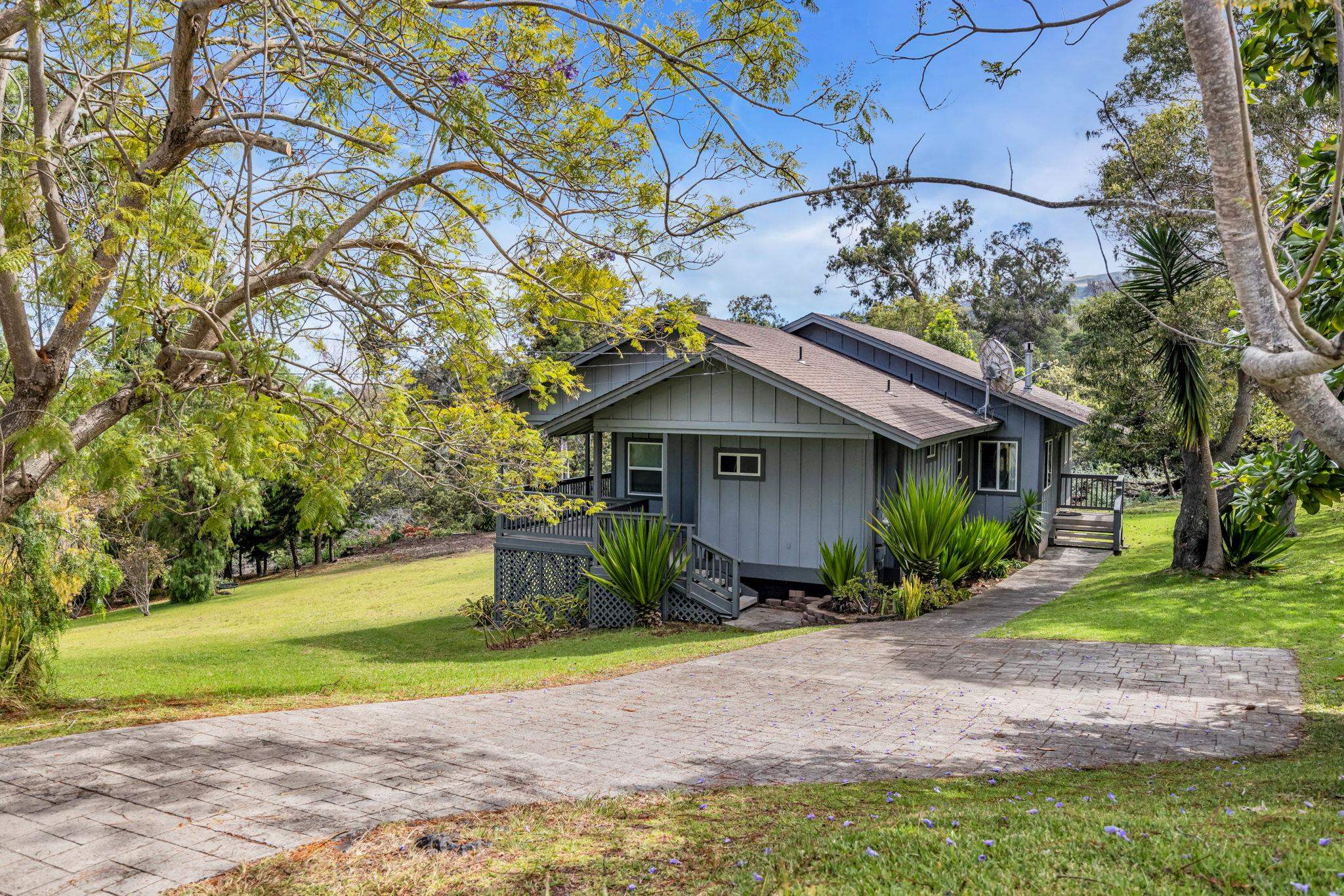 115 Alae Road Kula, HI 96790 - Photo 36 of 50 a front view of a house with garden