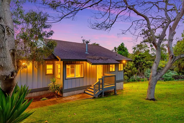 a view of a swimming pool with an outdoor space and seating area