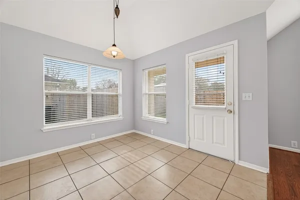 a view of an empty room with windows