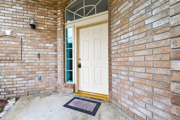 a view of wooden door with a chair