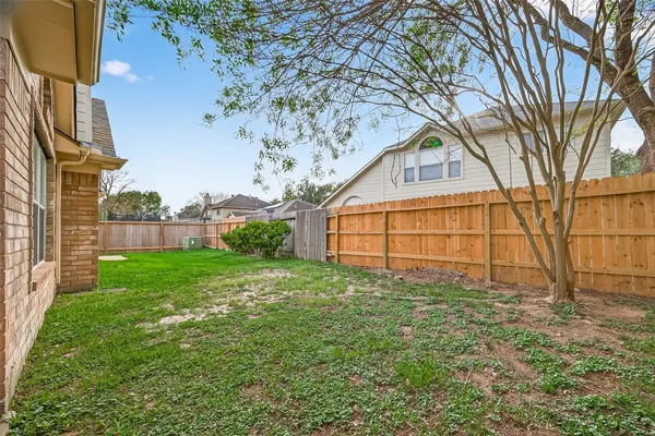 a view of a backyard of the house