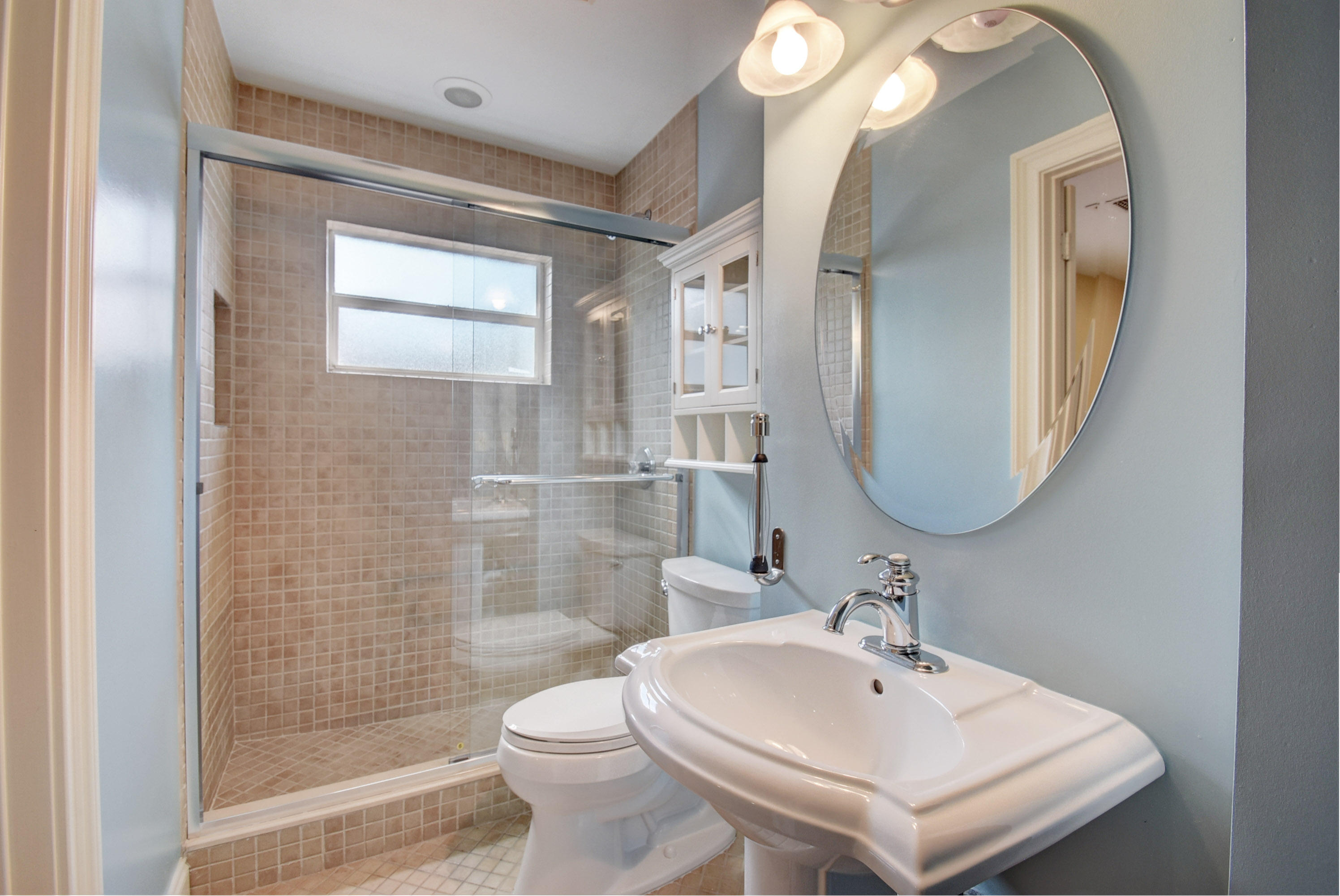 805 Northwest 2nd Avenue Boca Raton, FL 33432 - Photo 17 of 56 a bathroom with a sink a toilet and shower