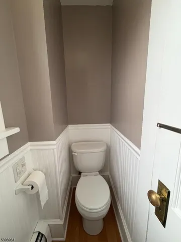 a bathroom with a toilet and a sink