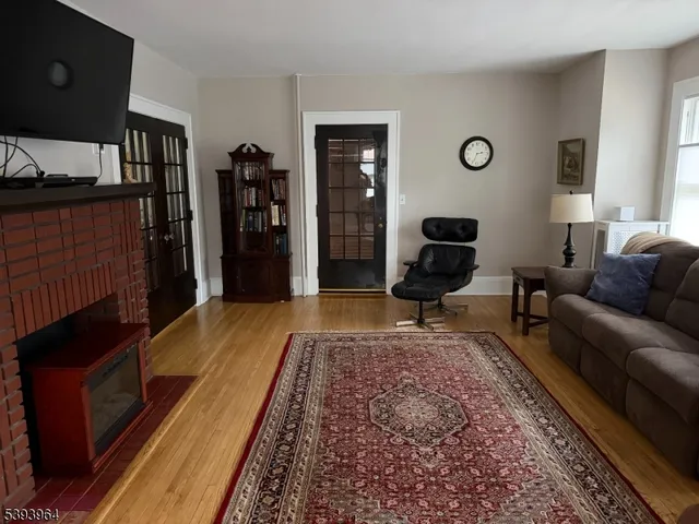 a living room with furniture and a rug
