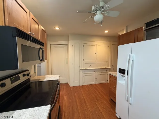 a kitchen with a refrigerator a sink and dishwasher