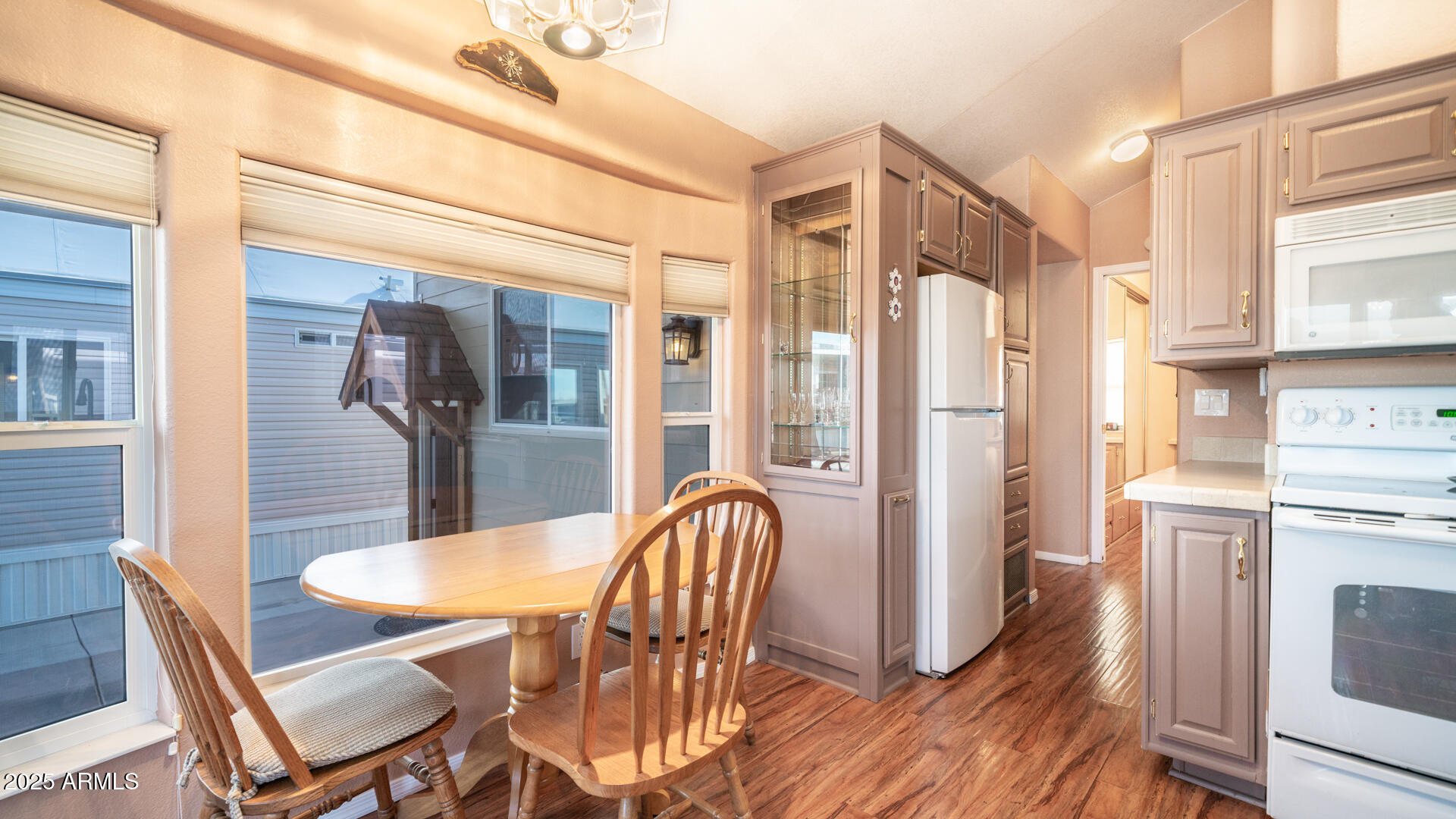 834-837 South Beryl/aquamarine Drive Apache Junction, AZ 85119 - Photo 11 of 68 a view of a dining room with furniture window and wooden floor
