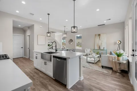 a kitchen with cabinets and a stove top oven