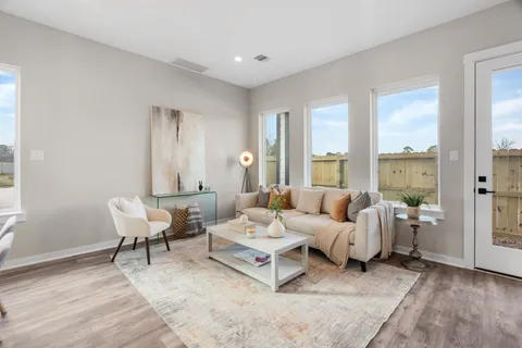 a living room with furniture and window