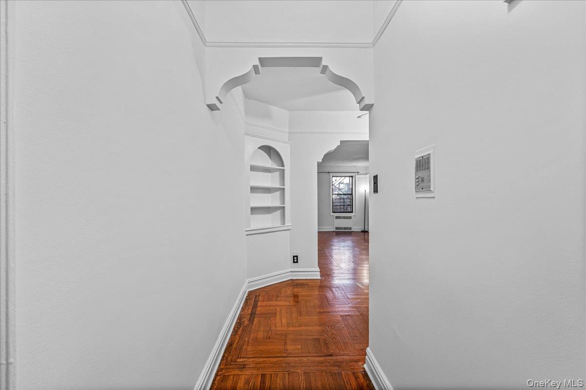 35-30 73rd Street, Unit 1F Queens, NY 11372 - Photo 13 of 24 a view of walk in closet with chandelier