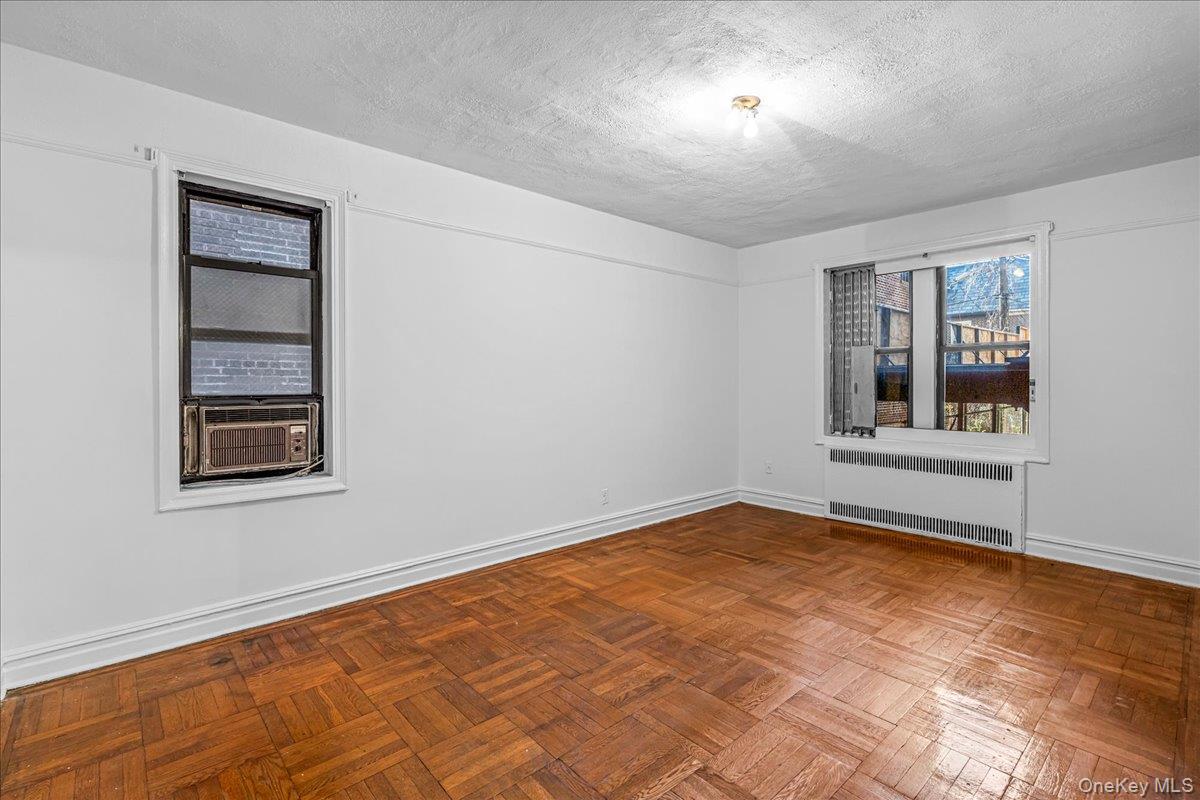 35-30 73rd Street, Unit 1F Queens, NY 11372 - Photo 8 of 24 a view of an empty room with a window