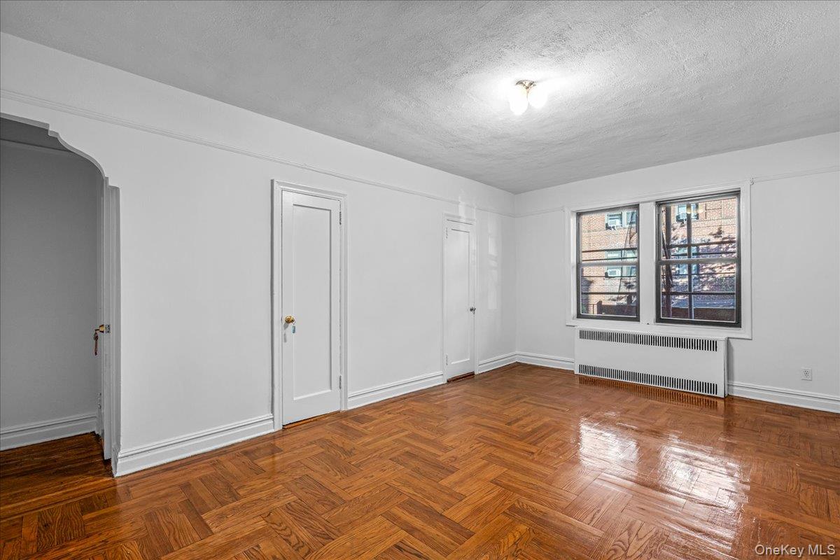 35-30 73rd Street, Unit 1F Queens, NY 11372 - Photo 10 of 24 a view of an empty room with a window